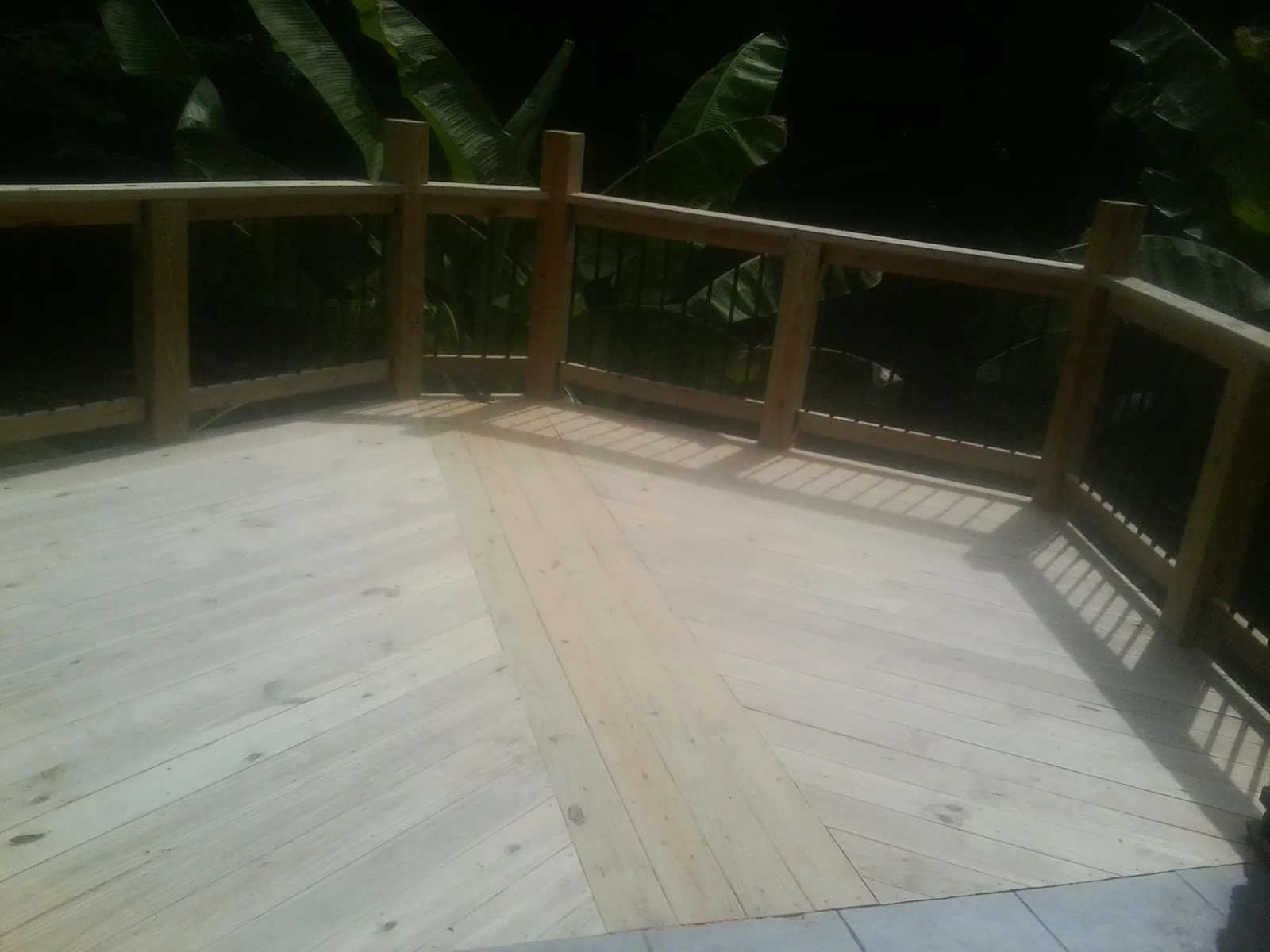 New wood deck and railing built off the back of a home in Barrytown
